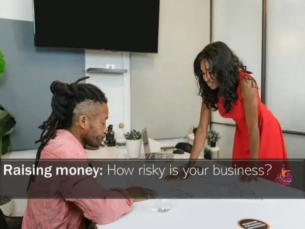 2 businesspeople discussing the risk in a business when raising money